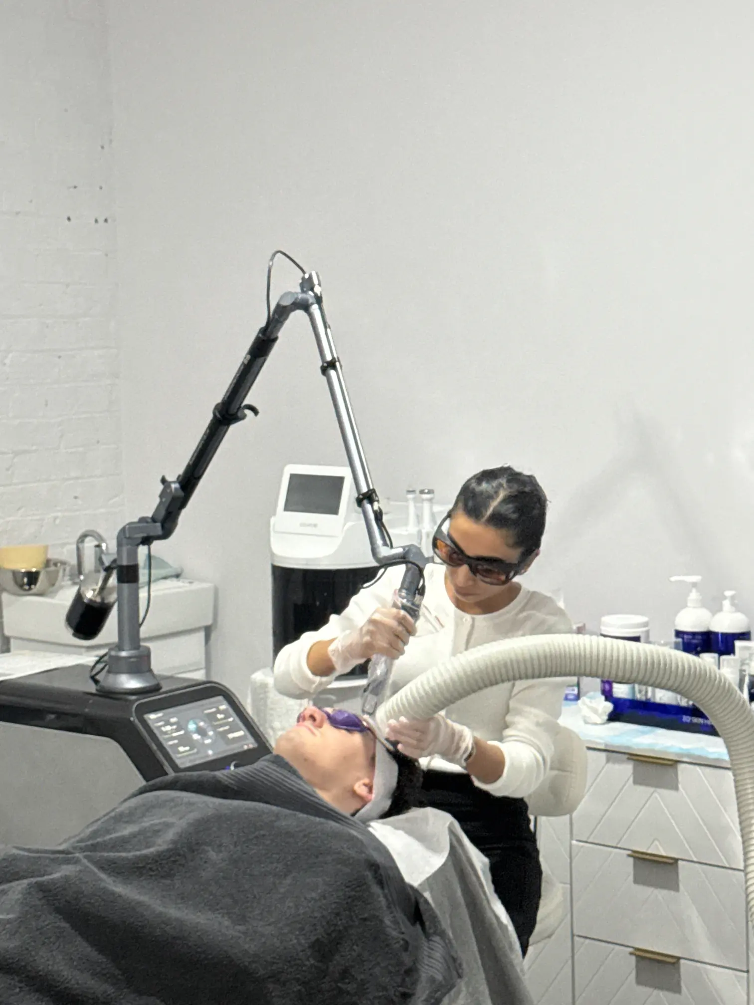 the IRIS Q-Switch laser service aims to rejuvenate skin by diminishing pigmentation, refining tone, and boosting collagen production for a more youthful appearance.