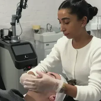 Clinician provides skin treatment